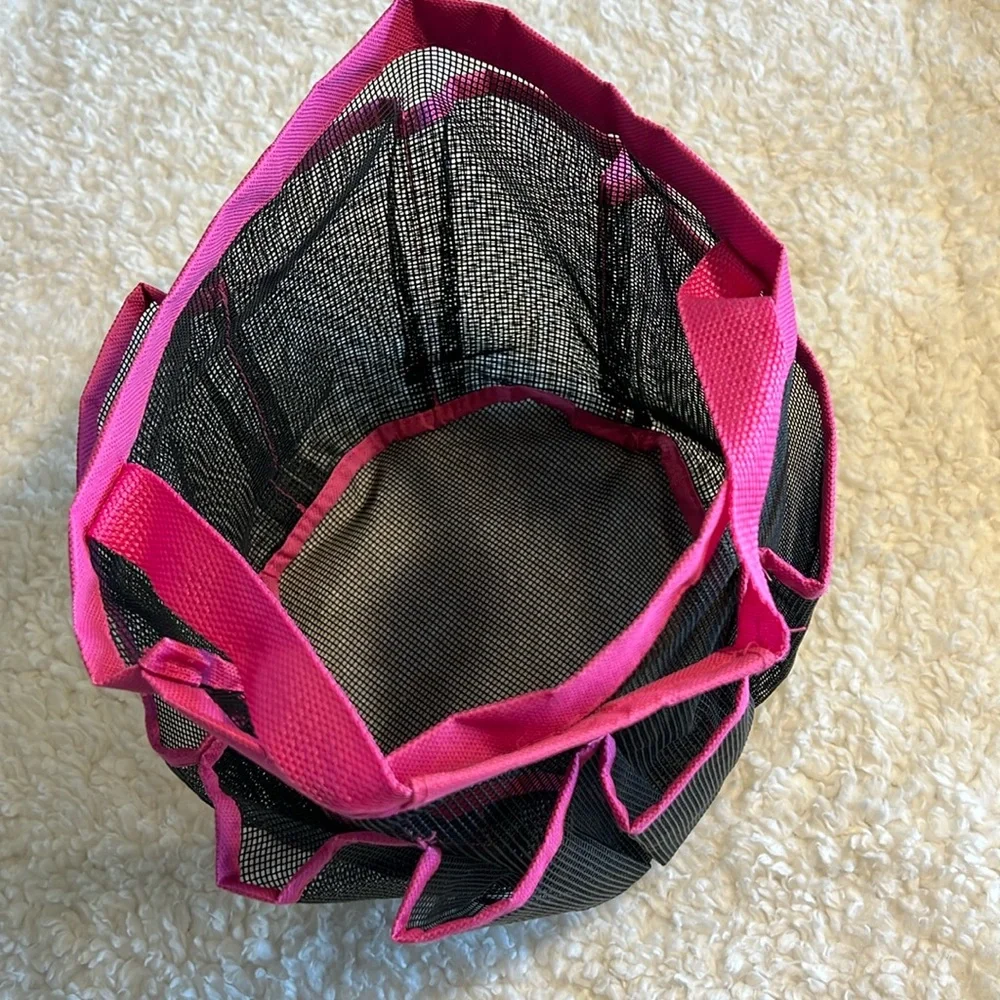 Mesh shower tote bag with 7 side pockets.